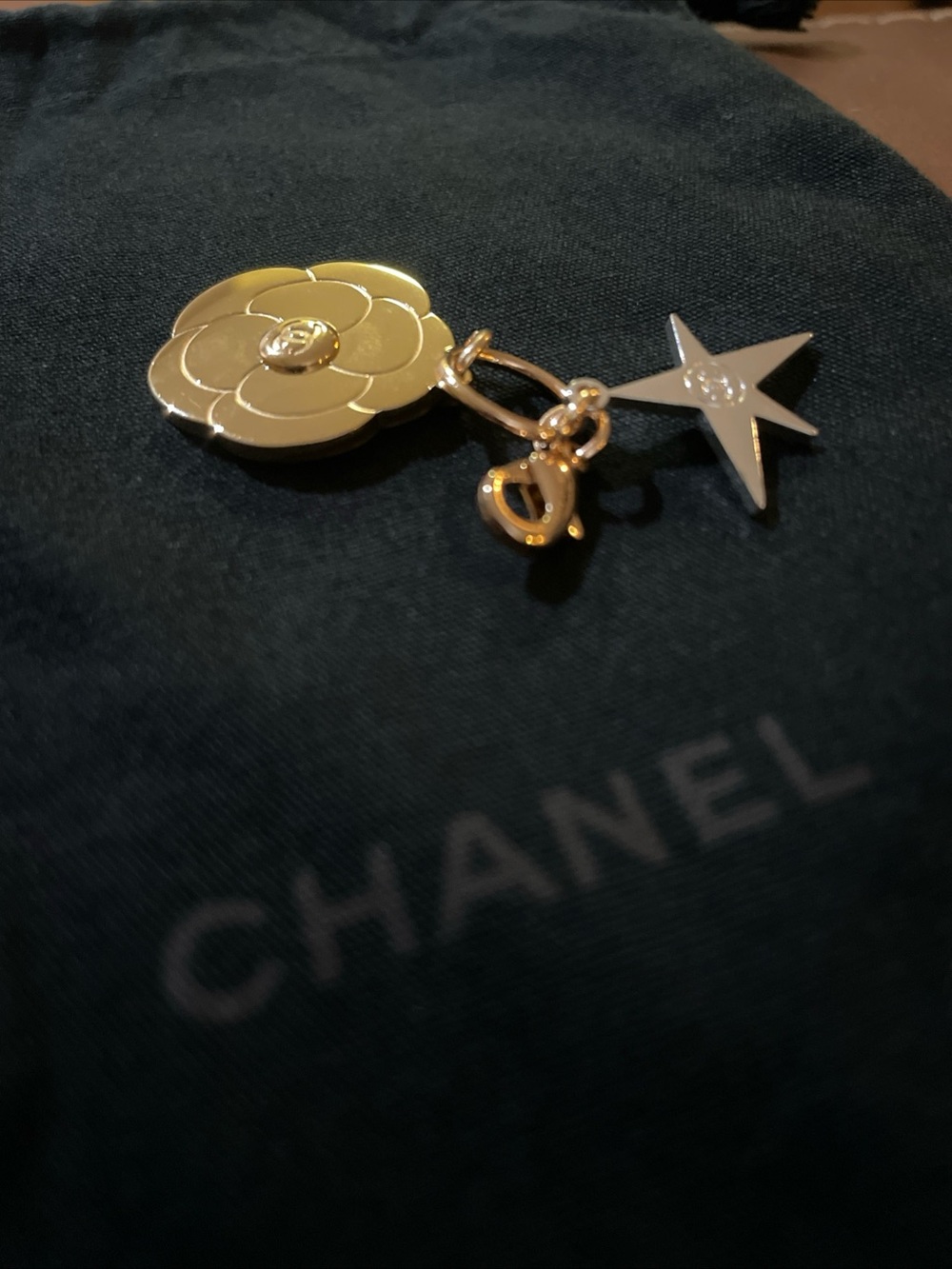 CHANEL Gold & Silver tone metal Camillia & Star Charm. 2025 Holiday Celestial